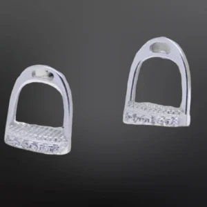A pair of horse stirrups with engraved design.